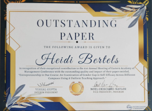 A certificate with the title "Outstanding Paper" awarded to Heidi Bertels for an exceptional contribution to the 61st Annual Meeting of the Eastern Academy of Management Conference, highlighting research on women entrepreneurs. The certificate features signatures from the vice presidents and decorative golden accents.